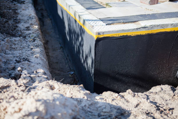 Professional Waterproofing technician working in Philo, OH